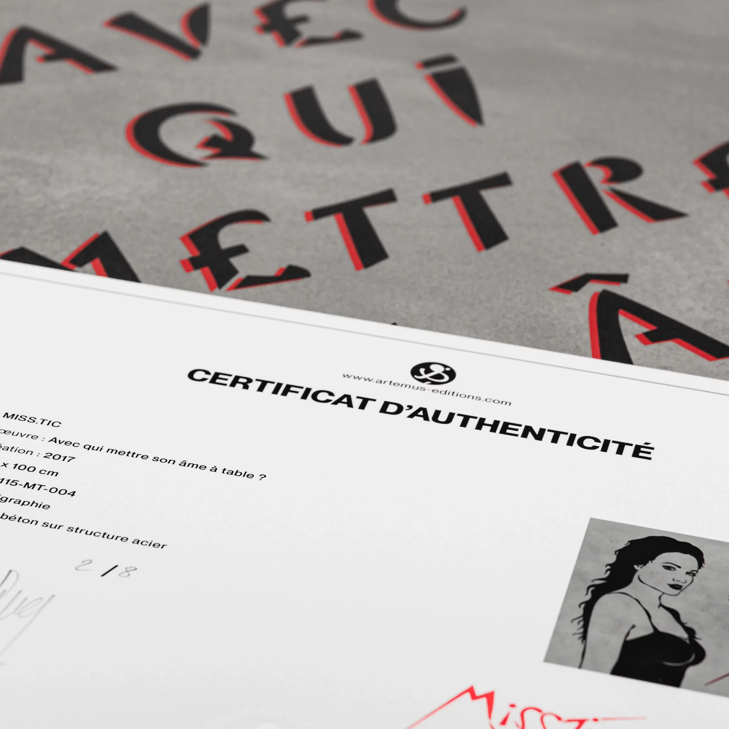 Close-up of the Miss.Tic limited edition concrete coffee table and certificate of authenticity